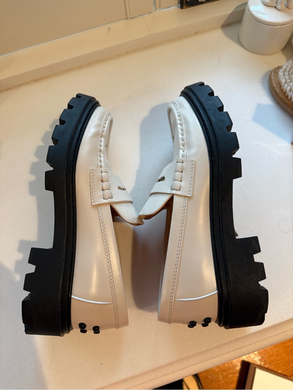 Tod’s Women’s White Leather Penny Loafers with Black Lug Sole - Picture 4 of 7